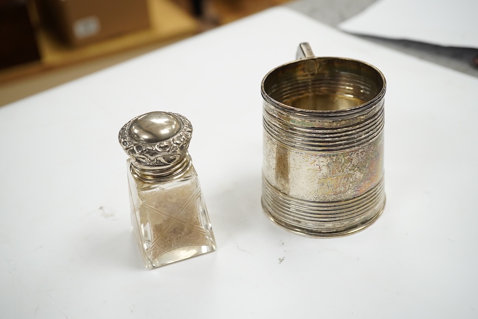 A George V repousse silver dressing table tray, William Neale Ltd, Birmingham, 1910, 29.1cm, two silver cigarette cases, a George III silver christening mug (a.f.) and four silver mounted glass toilet jars. Condition - p